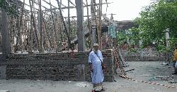 শিক্ষকের জমি দখল করে ভবন নির্মাণের অভিযোগ